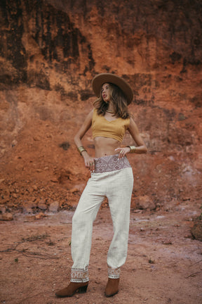 Wide trousers with tribal belt